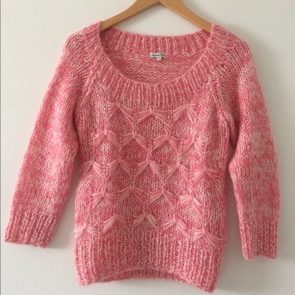 Pink and white knitted sweater